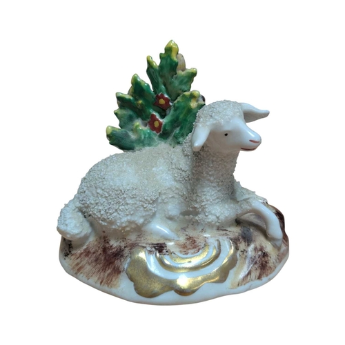 3 - A pair of 18th century Chelsea porcelain china sheep figures. Reclining position with floral / folia... 