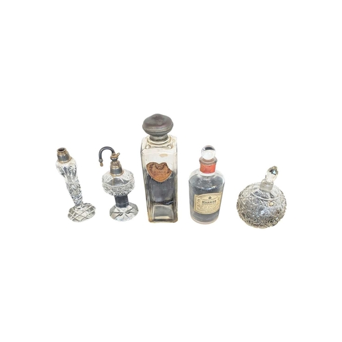33 - Collection of 20th century vintage empty glass perfume and beauty bottles. To include crystal cut ex... 