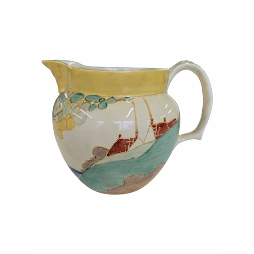 51 - Early 20th century Clarice Cliff pottery jug accompanied by a Paragon tea cup and saucer, and a Crow... 