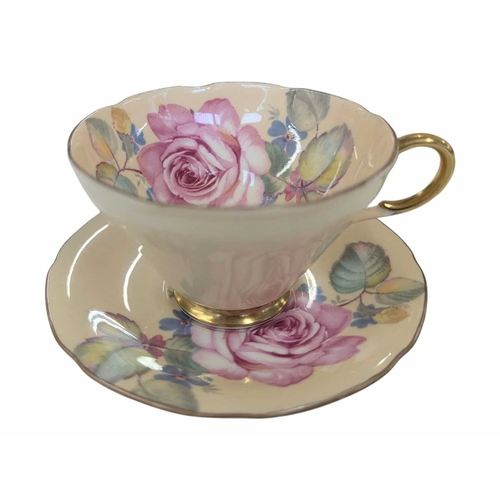 51 - Early 20th century Clarice Cliff pottery jug accompanied by a Paragon tea cup and saucer, and a Crow... 