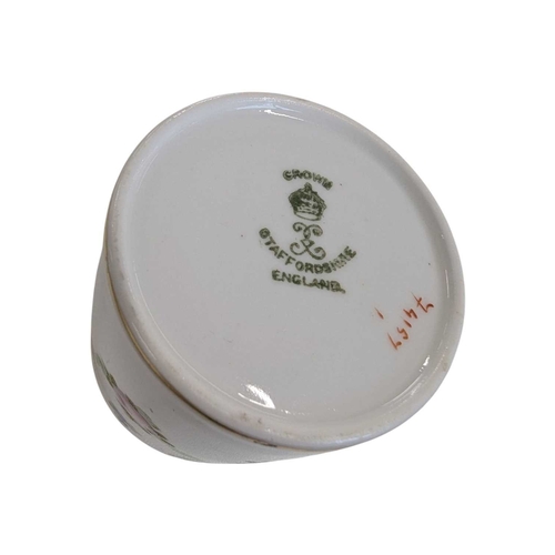 51 - Early 20th century Clarice Cliff pottery jug accompanied by a Paragon tea cup and saucer, and a Crow... 