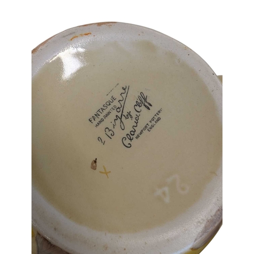 51 - Early 20th century Clarice Cliff pottery jug accompanied by a Paragon tea cup and saucer, and a Crow... 