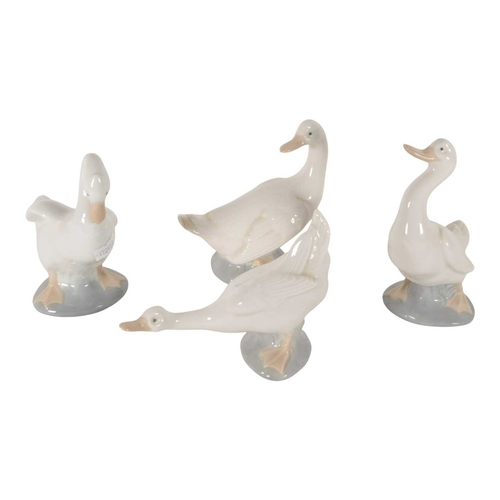 59 - Lladro Nao - A collection of four vintage 20th century porcelain duck figures. Each in pastel shades... 
