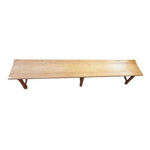 493 - An Arts & Crafts late 19th/early 20th century oak wood farmhouse bench seat. The bench having a ... 