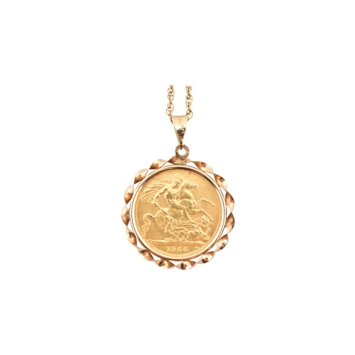 67 - An Elizabeth II sovereign mounted pendant and necklace chain. The sovereign dated to 1966. Weight of... 