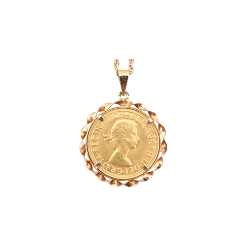 67 - An Elizabeth II sovereign mounted pendant and necklace chain. The sovereign dated to 1966. Weight of... 