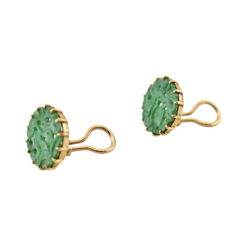 68 - A pair of French 18ct gold and carved jade panel ear clips. The earrings with pierced and carved rou... 
