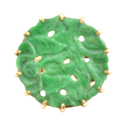 68 - A pair of French 18ct gold and carved jade panel ear clips. The earrings with pierced and carved rou... 