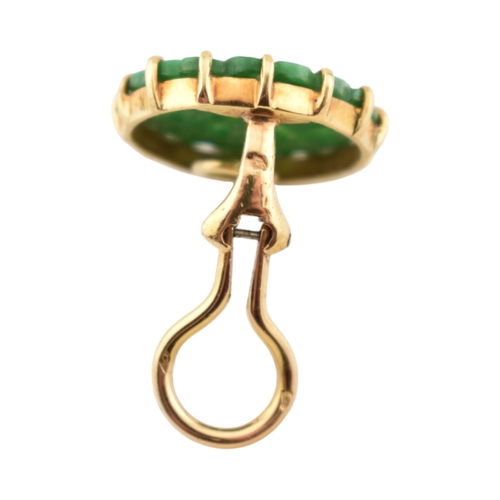 68 - A pair of French 18ct gold and carved jade panel ear clips. The earrings with pierced and carved rou... 