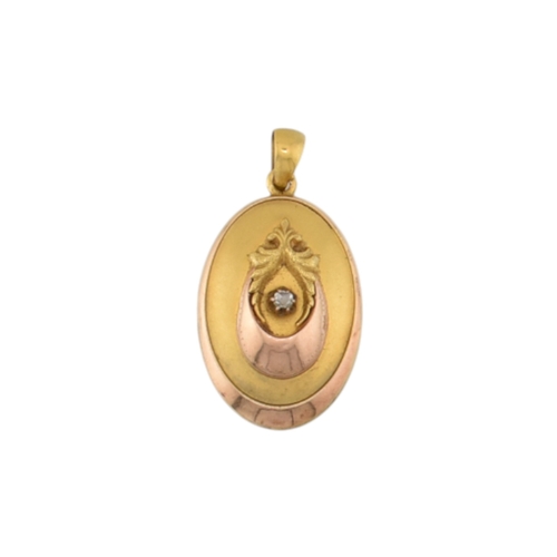 69 - A gold and diamond set locket pendant. The pendant set with a rose cut diamond framed by foliates an... 