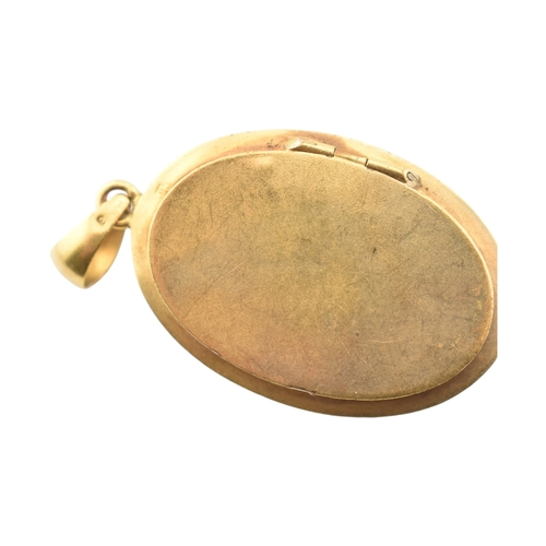 69 - A gold and diamond set locket pendant. The pendant set with a rose cut diamond framed by foliates an... 