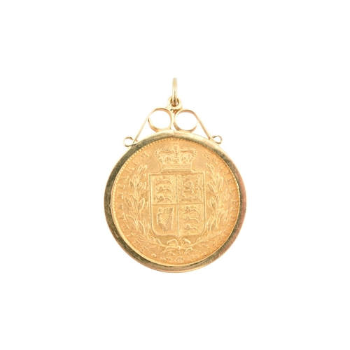 71 - A 9ct gold mounted Victoria 1869 young head shield back full gold sovereign, die No 4 necklace penda... 