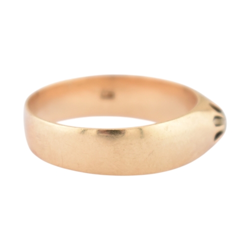 72 - An antique gold and diamond solitaire ring. The ring with a claw mounted old cut diamond to a wide b... 