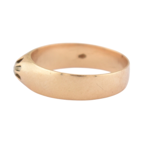 72 - An antique gold and diamond solitaire ring. The ring with a claw mounted old cut diamond to a wide b... 