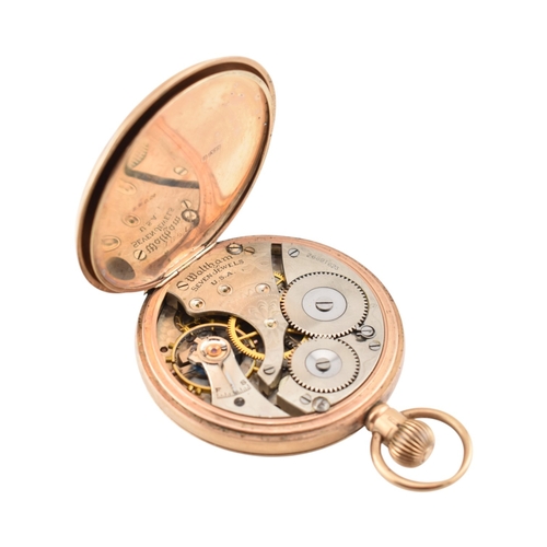 74 - An early 20th century hallmark 9ct gold Albert watch chain strung with a 1912 gold sovereign, togeth... 