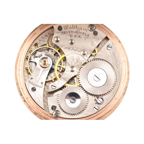 74 - An early 20th century hallmark 9ct gold Albert watch chain strung with a 1912 gold sovereign, togeth... 