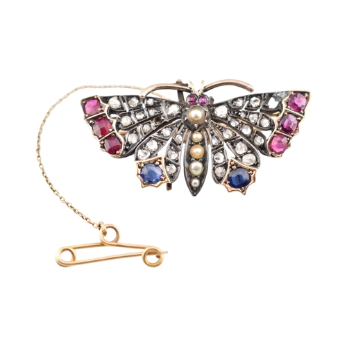 75 - A Victorian 19th century gold, ruby, sapphire, split pearl and diamond cluster set butterfly brooch.... 