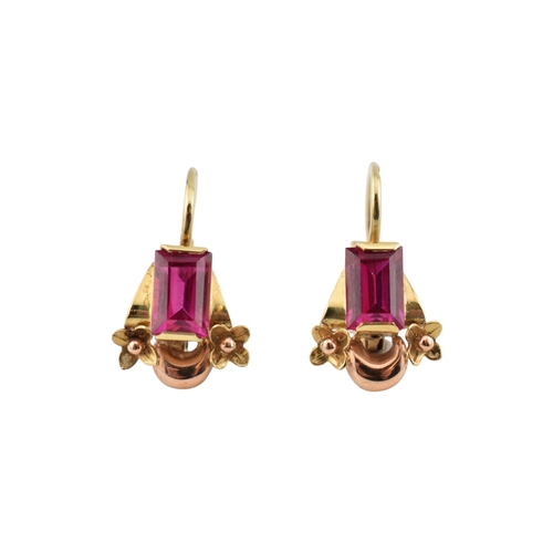 77 - A pair of 14ct gold and synthetic ruby pendant earrings. The earrings set with emerald cut synthetic... 