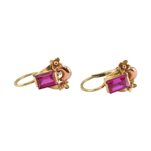 77 - A pair of 14ct gold and synthetic ruby pendant earrings. The earrings set with emerald cut synthetic... 