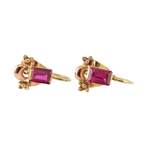 77 - A pair of 14ct gold and synthetic ruby pendant earrings. The earrings set with emerald cut synthetic... 