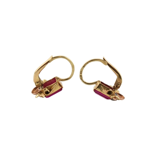77 - A pair of 14ct gold and synthetic ruby pendant earrings. The earrings set with emerald cut synthetic... 