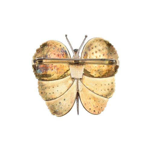 82 - An Art Deco silver paste set butterfly brooch pin. Weight 28g. Measures 5cm.