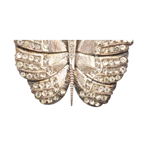 82 - An Art Deco silver paste set butterfly brooch pin. Weight 28g. Measures 5cm.