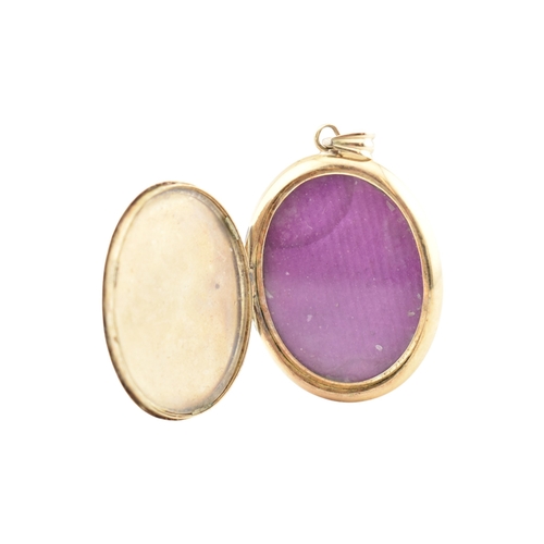 83 - An Austro-Hungarian gold enamel locket pendant. The locket with enamel decoration having engine turn... 