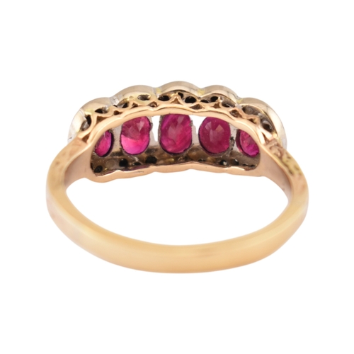 86 - A hallmarked 18ct gold ruby and diamond five stone cluster ring. Hallmarked Sheffield. Weight 5.3g. ... 