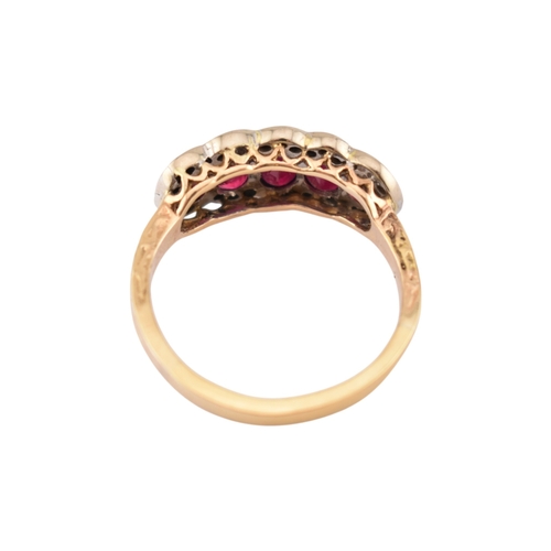 86 - A hallmarked 18ct gold ruby and diamond five stone cluster ring. Hallmarked Sheffield. Weight 5.3g. ... 