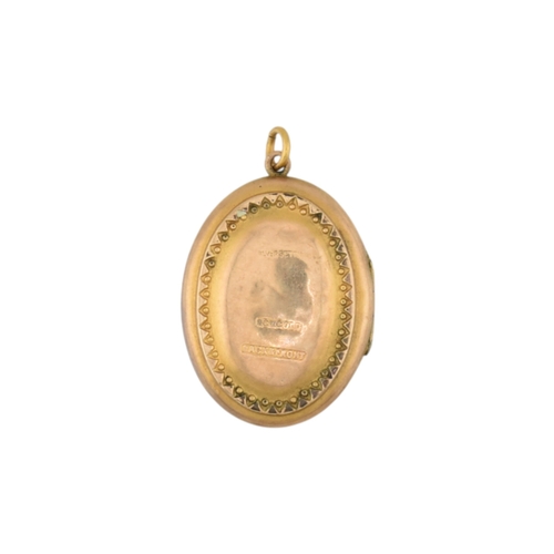 88 - A Victorian 9ct gold back and front locket with pearl and amethyst swallow decoration. Marked silver... 