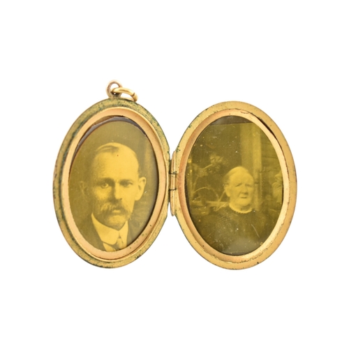 88 - A Victorian 9ct gold back and front locket with pearl and amethyst swallow decoration. Marked silver... 