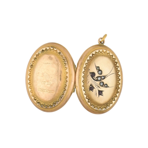 88 - A Victorian 9ct gold back and front locket with pearl and amethyst swallow decoration. Marked silver... 