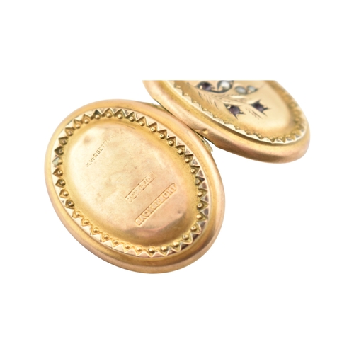 88 - A Victorian 9ct gold back and front locket with pearl and amethyst swallow decoration. Marked silver... 