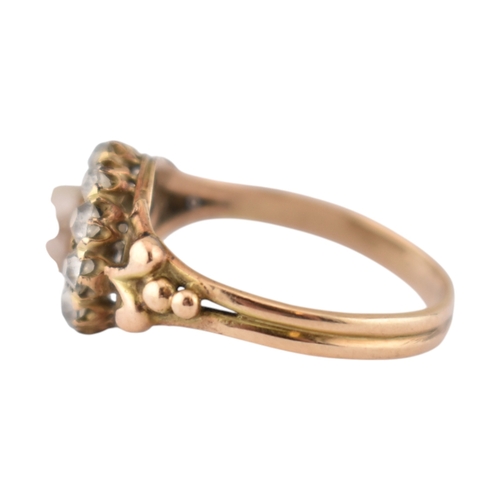 90 - An early 20th century pearl and diamond cluster ring. The ring set with a central pearl framed by ol... 