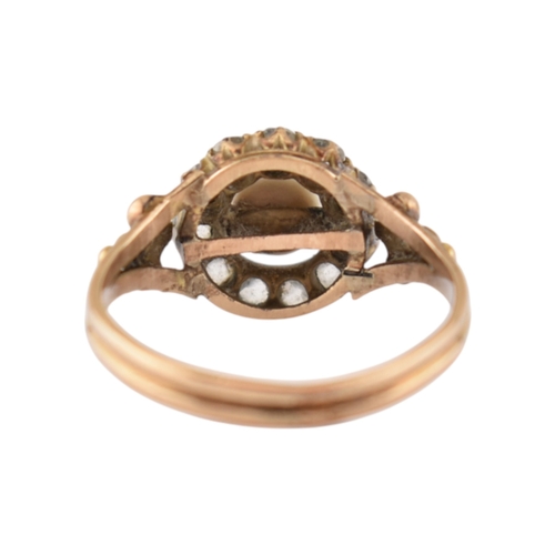 90 - An early 20th century pearl and diamond cluster ring. The ring set with a central pearl framed by ol... 