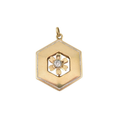 91 - A gold diamond enamel flower pendant. The hexagonal pendant with a central flower motif set with an ... 