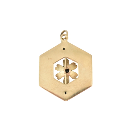 91 - A gold diamond enamel flower pendant. The hexagonal pendant with a central flower motif set with an ... 