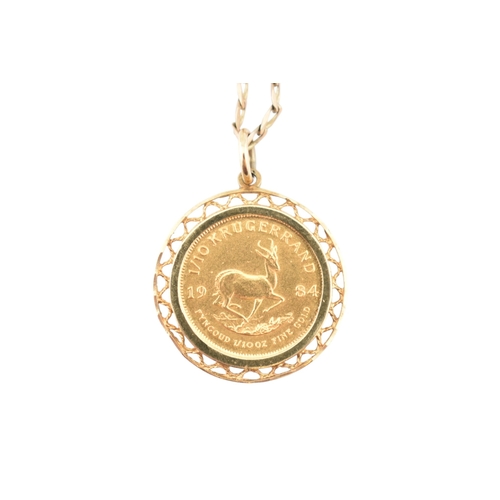 94 - A South African gold one-tenth 1/10 oz Krugerrand 1984 coin inset to a pendant mount and strung upon... 
