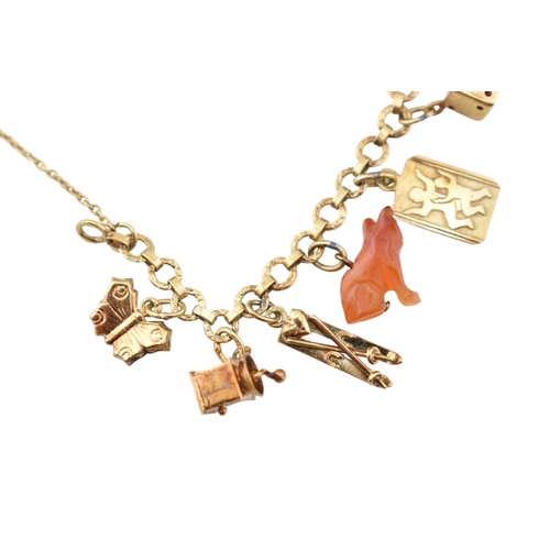 102 - Two Czechoslovakian 14ct gold charm bracelets. The bracelets strung with assorted charms, including ... 