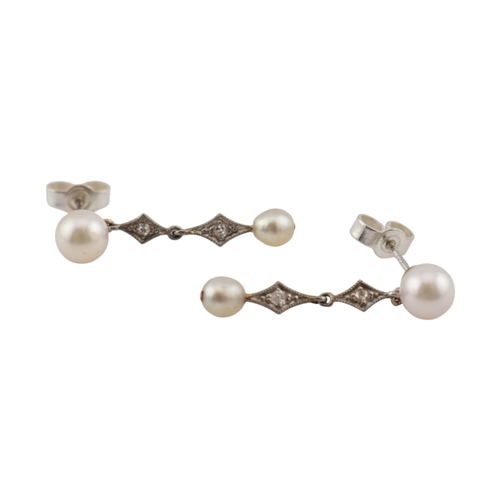 103 - A pair of pearl and diamond pendant earrings. The earrings marked of 18K to posts. Fasteners tests s... 