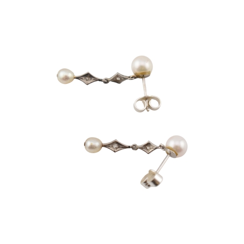 103 - A pair of pearl and diamond pendant earrings. The earrings marked of 18K to posts. Fasteners tests s... 