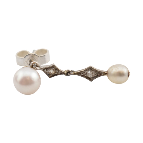 103 - A pair of pearl and diamond pendant earrings. The earrings marked of 18K to posts. Fasteners tests s... 
