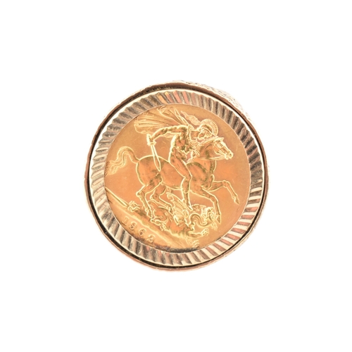 104 - A 9ct gold sovereign ring. The ring set with a 1962 full sovereign with pierced shoulders. Total wei... 