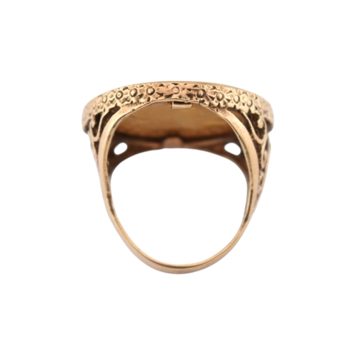 104 - A 9ct gold sovereign ring. The ring set with a 1962 full sovereign with pierced shoulders. Total wei... 