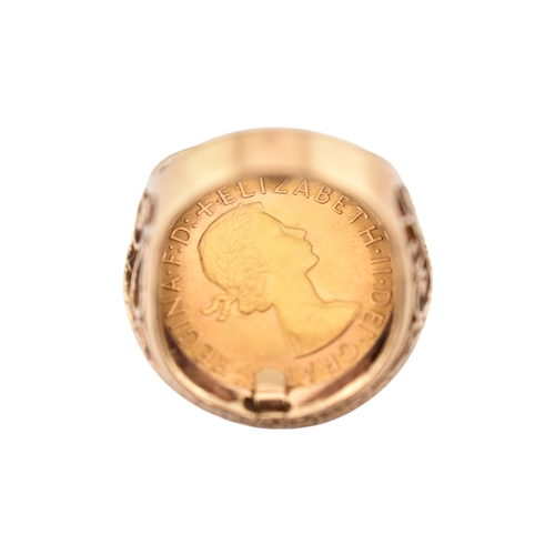 104 - A 9ct gold sovereign ring. The ring set with a 1962 full sovereign with pierced shoulders. Total wei... 
