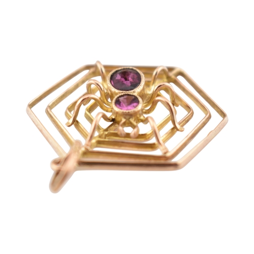 106 - A 9ct gold spider gem set pendant. The pendant marked 9ct. Measures 3cm including bail.