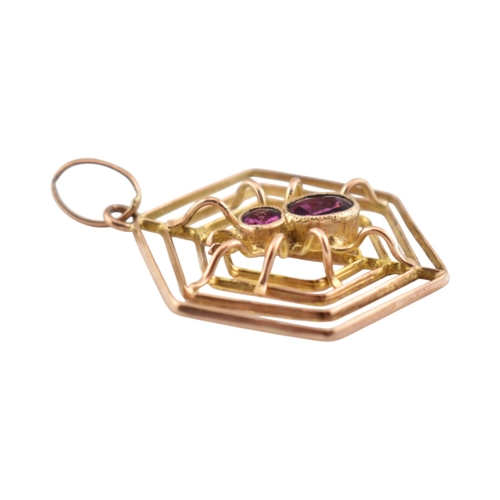 106 - A 9ct gold spider gem set pendant. The pendant marked 9ct. Measures 3cm including bail.
