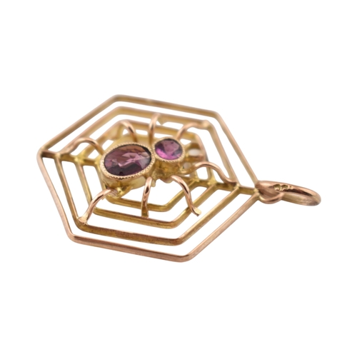 106 - A 9ct gold spider gem set pendant. The pendant marked 9ct. Measures 3cm including bail.