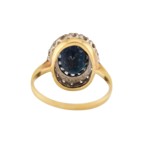 108 - An 18ct gold sapphire and diamond cluster ring. Stamped 18ct. Weight 3.9g. Size K